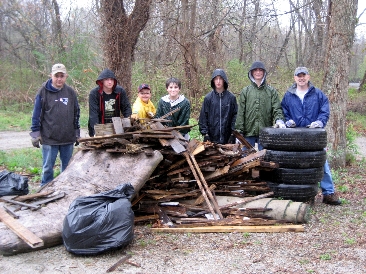 Group of Riverbend Farm volunteers posing with collected trash